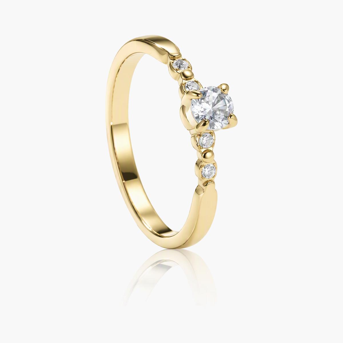 Dainty Solitaire With Side Stones Ring