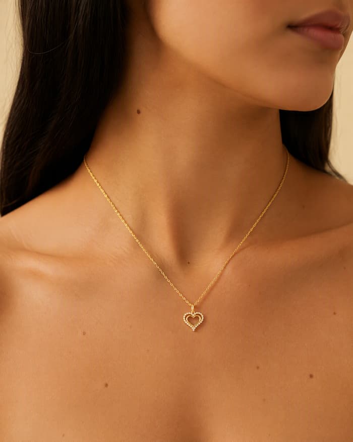 Dainty Hollow Heart Pendant Necklace — worn